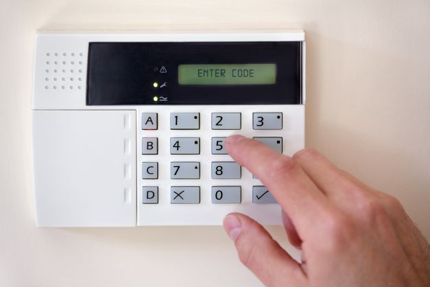 Security code being entered into burglar alarm